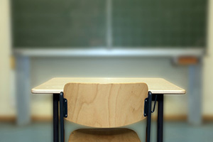 Empty desk in classroom - addressing absetenteeism