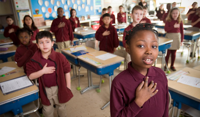 Charter school classroom students saying the pledge of allegiance