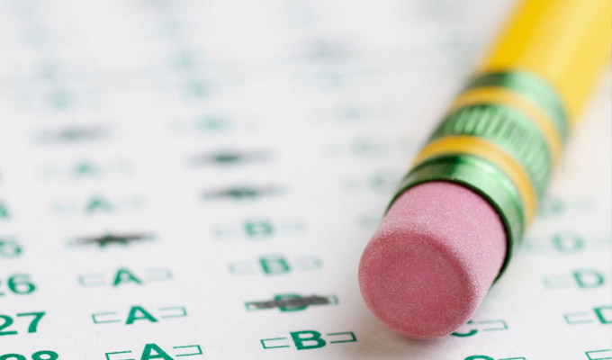 Pencil with eraser on standardized test sheet