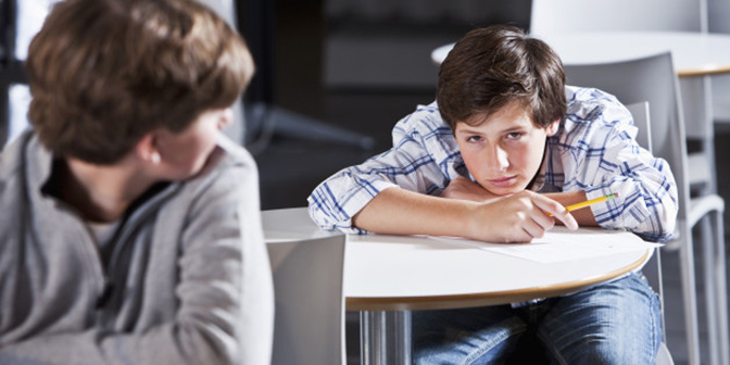 Despondent male student in school
