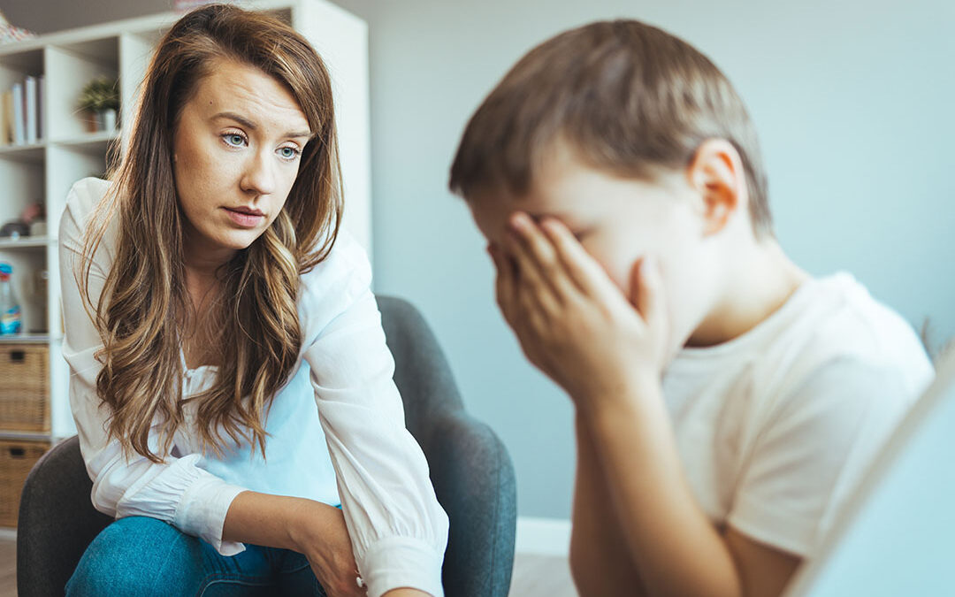 Mother talking to her distraught son